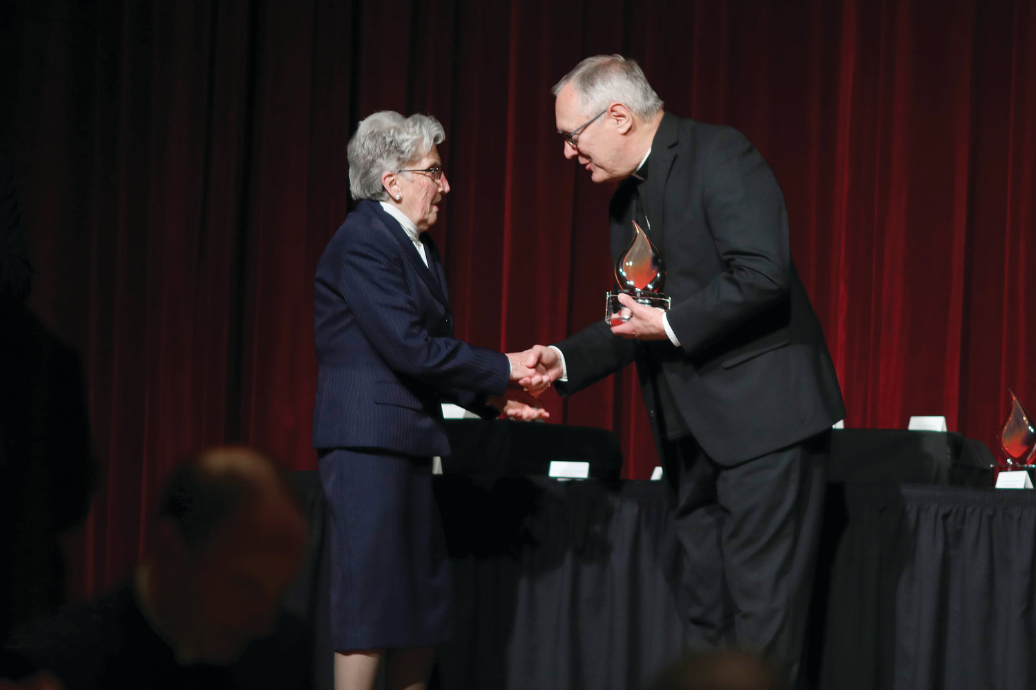 Bishop Thomas J. Tobin, presents Sister Carol Anne Murray, RSM with a Lifetime Achievement Award in Catholic Education.